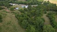 Great picture showing some of the nearly 59 acres from behind the outbuildings and home