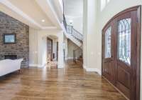 Large Entry Foyer with beautiful all wood custom doors