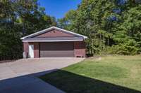 All brick 1600 sq foot separate building that can be a workshop and more garage space. Has water and electricity. Very nice!