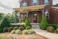 Covered front porch ready for your patio furniture, rocking chair, and your coffee ;) 