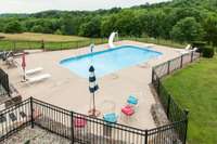 View of the pool from sunroom off family room.