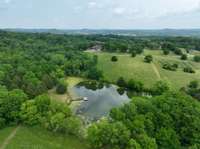 Lake features fishing dock and picnic area. 