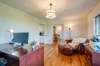 The formal dining room connects to the kitchen to the left. 