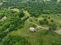 The first barn you see when entering the property is a Tobacco barn from 1962.