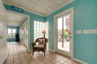 Hallway that leads outside to the pool and to the pool party room!