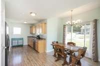 Dining room and kitchen are set up perfectly for a quiet meal or entertaining friends.