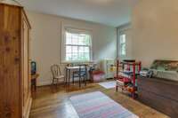 Second upstairs bedroom used as a playroom. Stunning views out above the porch.