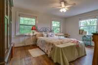 Upstairs End bedroom is spacious and bright with fantastic views and hardwood floors.