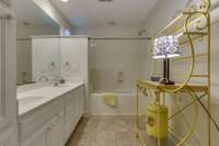 Upstairs hall bath. Double vanities ,separate toilet closet and lots of cabinet space make it convenient between the bedrooms.