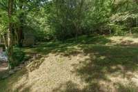 Steps leading from drive to the back yard and woods area.