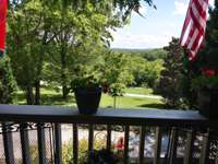 Lovely wide covered porch is the perfect spot to start and end your day!