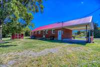 DRIVE-THROUGH CARPORT WITH DOUBLE ROAD ACCESS