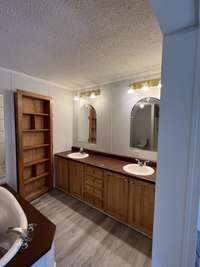 Master Bath w/Double Vanities and 2 Entrances into the Master Closet