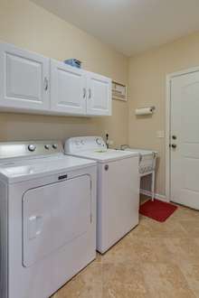 Utility Room w/ Sink & Built In Cabinets