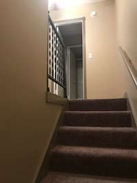 Stairway to ample sized bedrooms