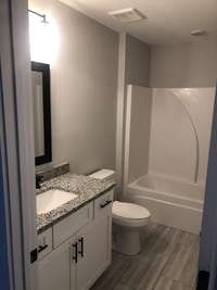 Upstairs bath with granite tops and tile floors