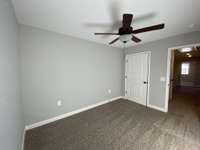 Bedroom 2 upstairs   *Photo is from a completed unit with same grade finishes. Same layout.*