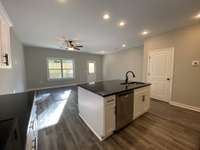 Kitchen comes complete with granite countertops and a pantry!  *Photo is from a completed unit with same grade finishes. Same layout.*