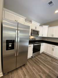 All units come with stainless steel appliances  *Photo is from a completed unit with same grade finishes. Same layout.*