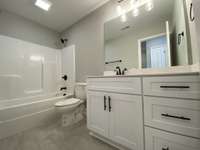 Hall bath upstairs   *Photo is from a completed unit with same grade finishes. Same layout.*