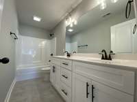 Master bathroom  *Photo is from a completed unit with same grade finishes. Same layout.*