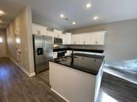 Lots of storage in this kitchen  *Photo is from a completed unit with same grade finishes. Same layout.*