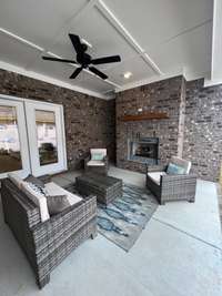 Great covered outdoor space with gas fireplace, tv connection and gas line for grilling.