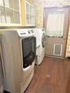 Laundry Room with back door access. 