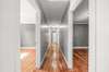 Hallway with freshly stained hardwood floors