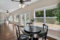 A Large Sunroom With Room for Extra Dining, Extra Seating, An Office? The Possibilities are Endless in This Expansive Sunlit Room. 