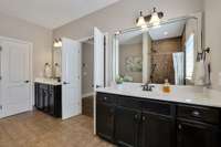 You'll Love the Separate Vanities in this Grand Bath adjoining the Primary Bedroom. 