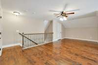 Hardwood Stairs Lead to the Oversized Bonus Room with Hardwood Flooring, & Two Large Closets for Additional Storage. The Unique Layout of this Bonus Room Provides Room for an Office, Hang Out or Workout Space, & Even a Guest Sleeping Space. 