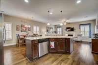 A chef's dream kitchen offering a large island providing more counter space & seating! Lovely pendant lights above the island offering perfect lighting for a kitchen! 1027 Waterstone Drive Lebanon, TN 37090