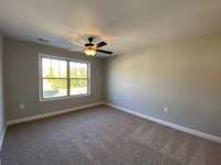 Master bedroom  *Photo is from a finished neighboring unit with same floor plan*