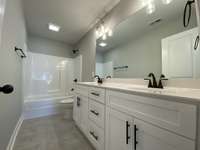 Master bathroom  *Photo is from a finished neighboring unit with same floor plan*