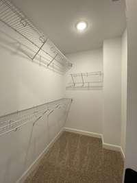 Master closet  *Photo is from a finished neighboring unit with same floor plan*