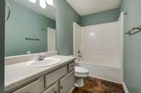 Tiled flooring in both full bathrooms. 