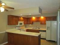 KITCHEN LAST UPDATED IN THE 90S.  MICROWAVE WILL NEED REPLACEMENT BUT STOVE IS FAIRLY NEW AND IN GOOD CONDITION, NOTHING MAJOR WRONG EXCEPT MICROWAVE, KITCHEN VINYL WILL NEED REPLACING.  