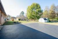 Large Parking Pad - Two Storage Buildings to Remain 