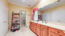 Master bath #2 featuring a tiled shower.