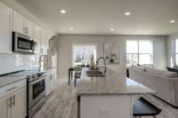 Granite countertops - comfortably fit 4 seats at the island