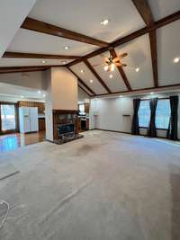 expanded view of the great room with view of kitchen/dinette area 