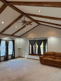 Living/Great room with cathedrial ceiling with wood beams, get that farmhouse feel, also lots of recessed lighting