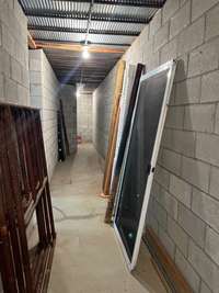 another view of storm shelter underneath front porch, access is through the basement