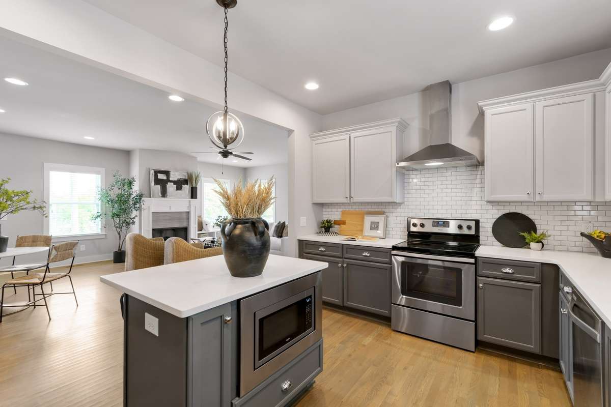 Eat-in kitchen with high-end stainless steel appliances, tons of cabinetry, walk-in pantry, and plenty of countertop space for all your prep needs.