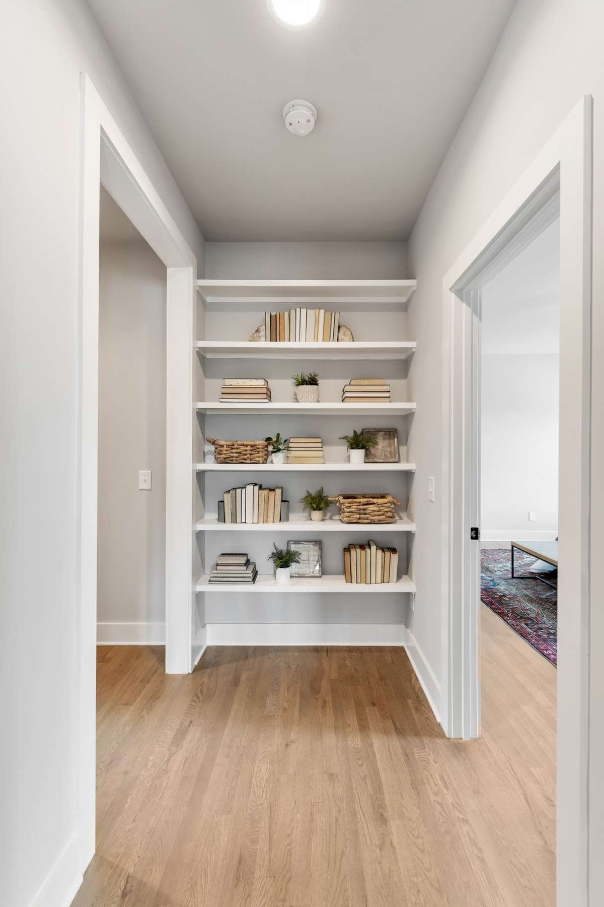Pretty shelving downstairs, leading to Primary Bedroom