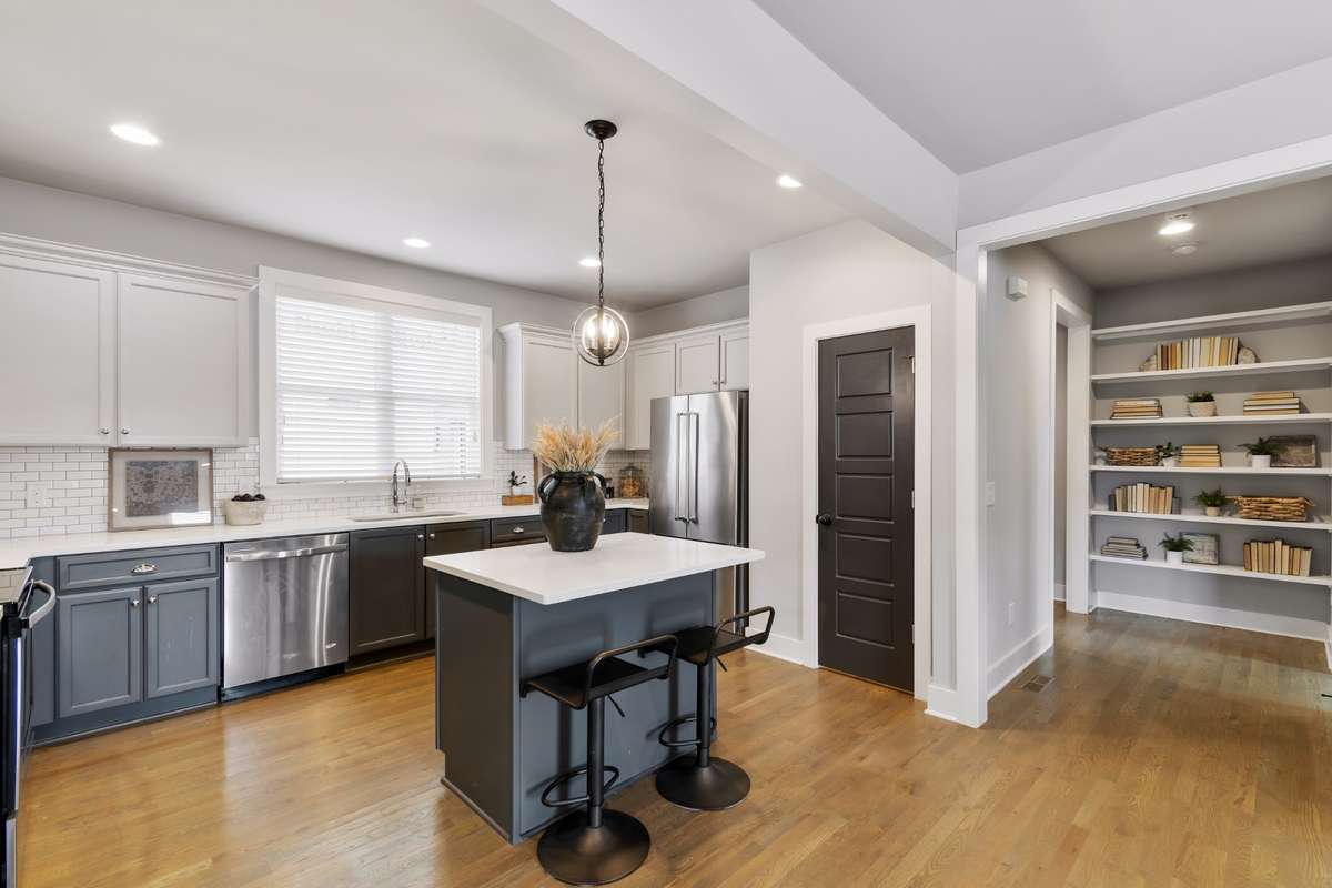 Eat-in kitchen with high-end stainless steel appliances, tons of cabinetry, walk-in pantry, and plenty of countertop space for all your prep needs.