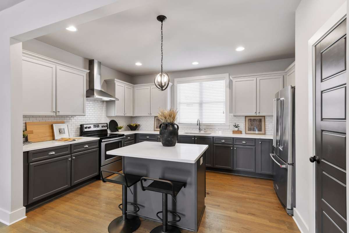 Eat-in kitchen with high-end stainless steel appliances, tons of cabinetry, walk-in pantry, and plenty of countertop space for all your prep needs.