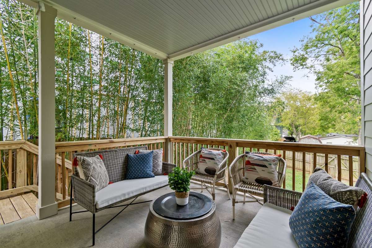 The back covered porch is perfect for entertaining. It overlooks the fully fenced backyard.