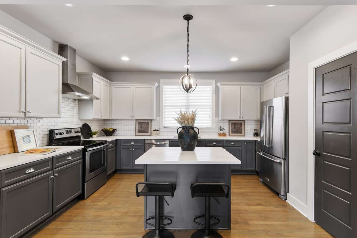 Eat-in kitchen with high-end stainless steel appliances, tons of cabinetry, walk-in pantry, and plenty of countertop space for all your prep needs.